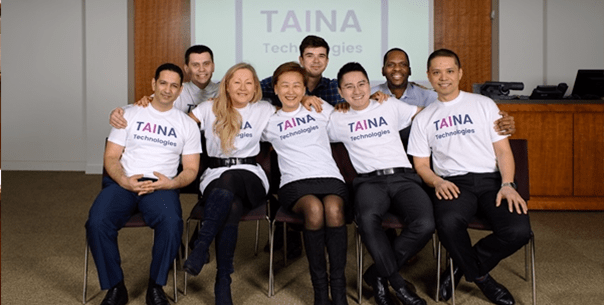 Booth EMBA Graduate and TAINA Founder, Maria Scott, sits with her start-up team