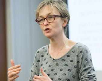 Professor Marianne Bertrand teaching in front of a class