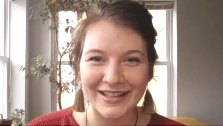 Thumbnail of video featuring a smiling female MBA student 