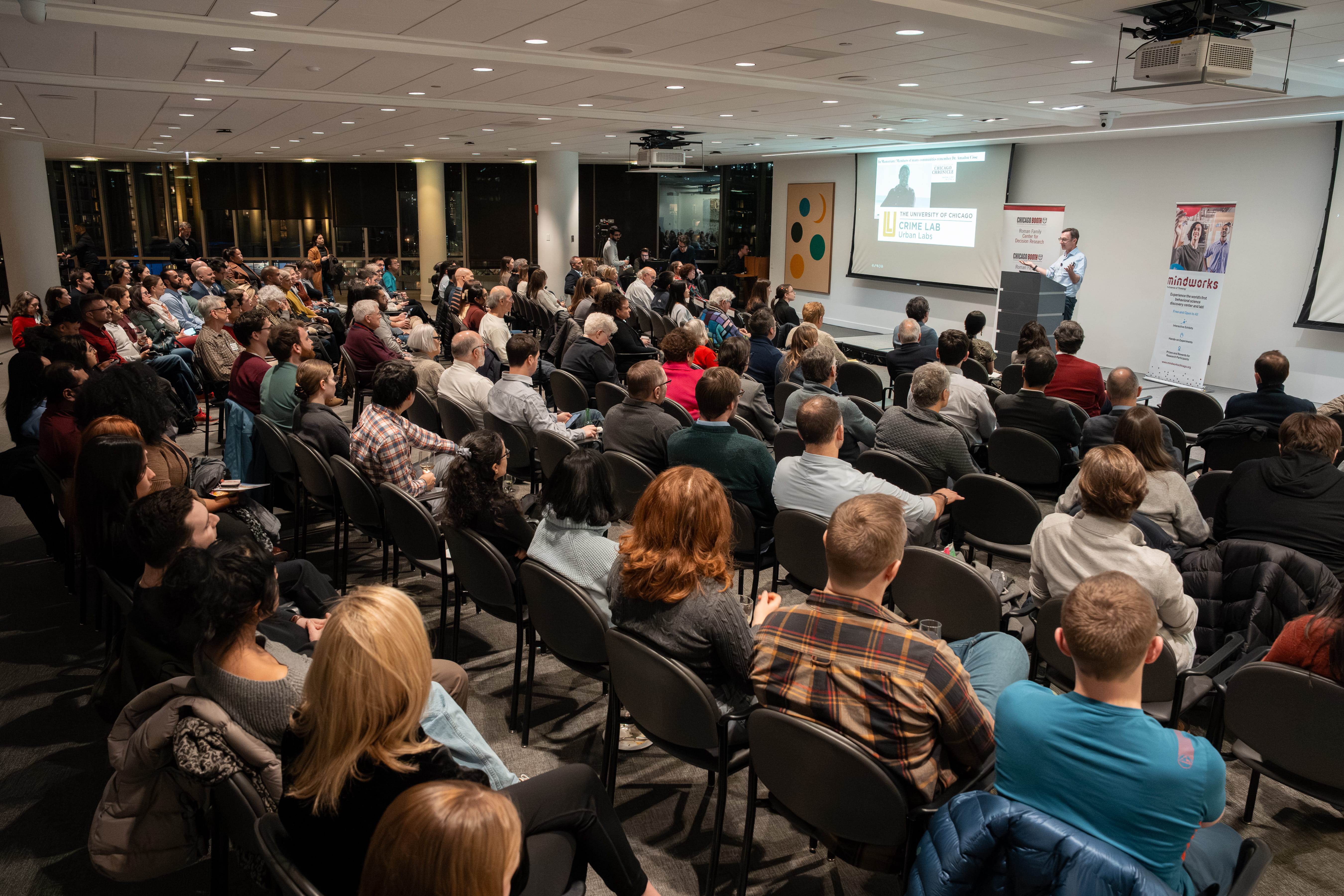 Jens Ludwig at the podium, audience